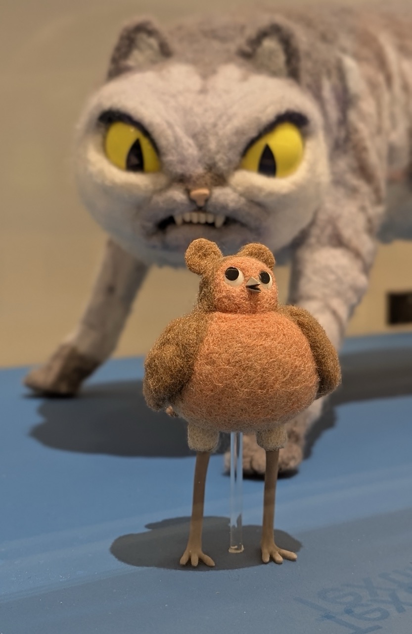 The Robin Robin model with a cat in the background